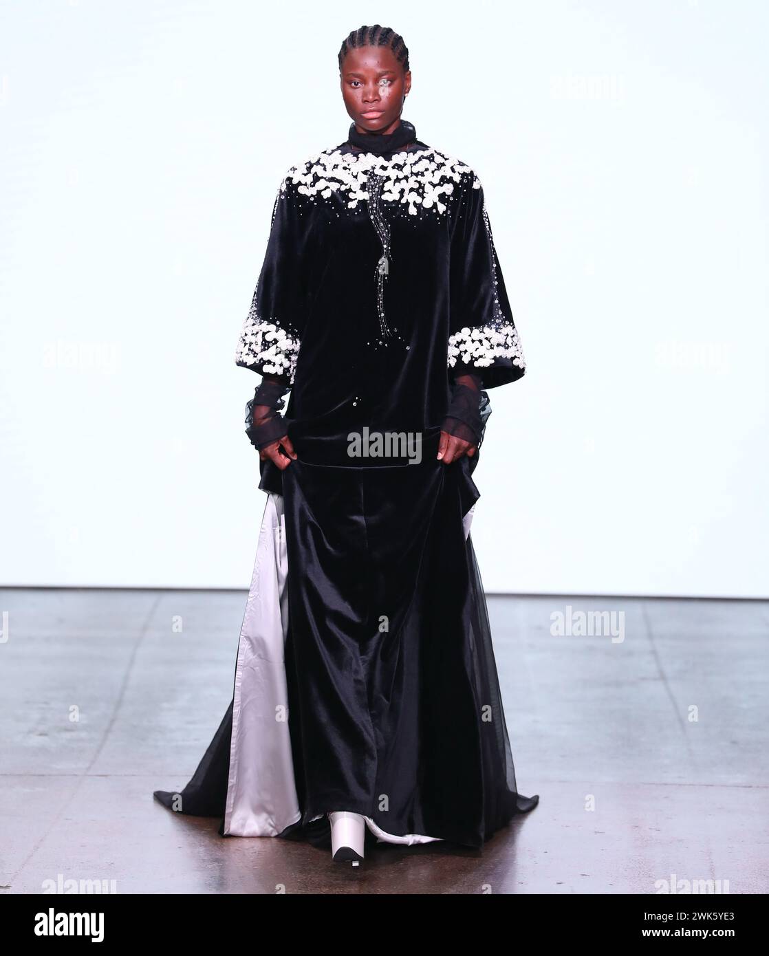 London, UK. 18th Feb, 2025. A model walks the runway during the SUNCUN