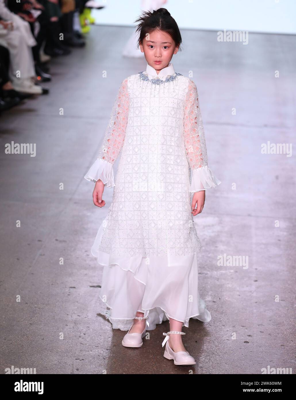 London, UK. 18th Feb, 2025. A model walks the runway during the SUNCUN