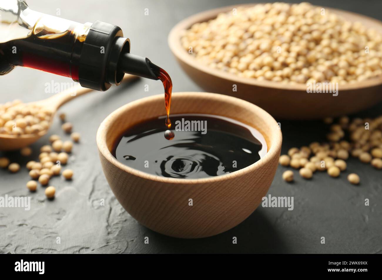 Pouring tasty soy sauce from bottle, closeup Stock Photo - Alamy