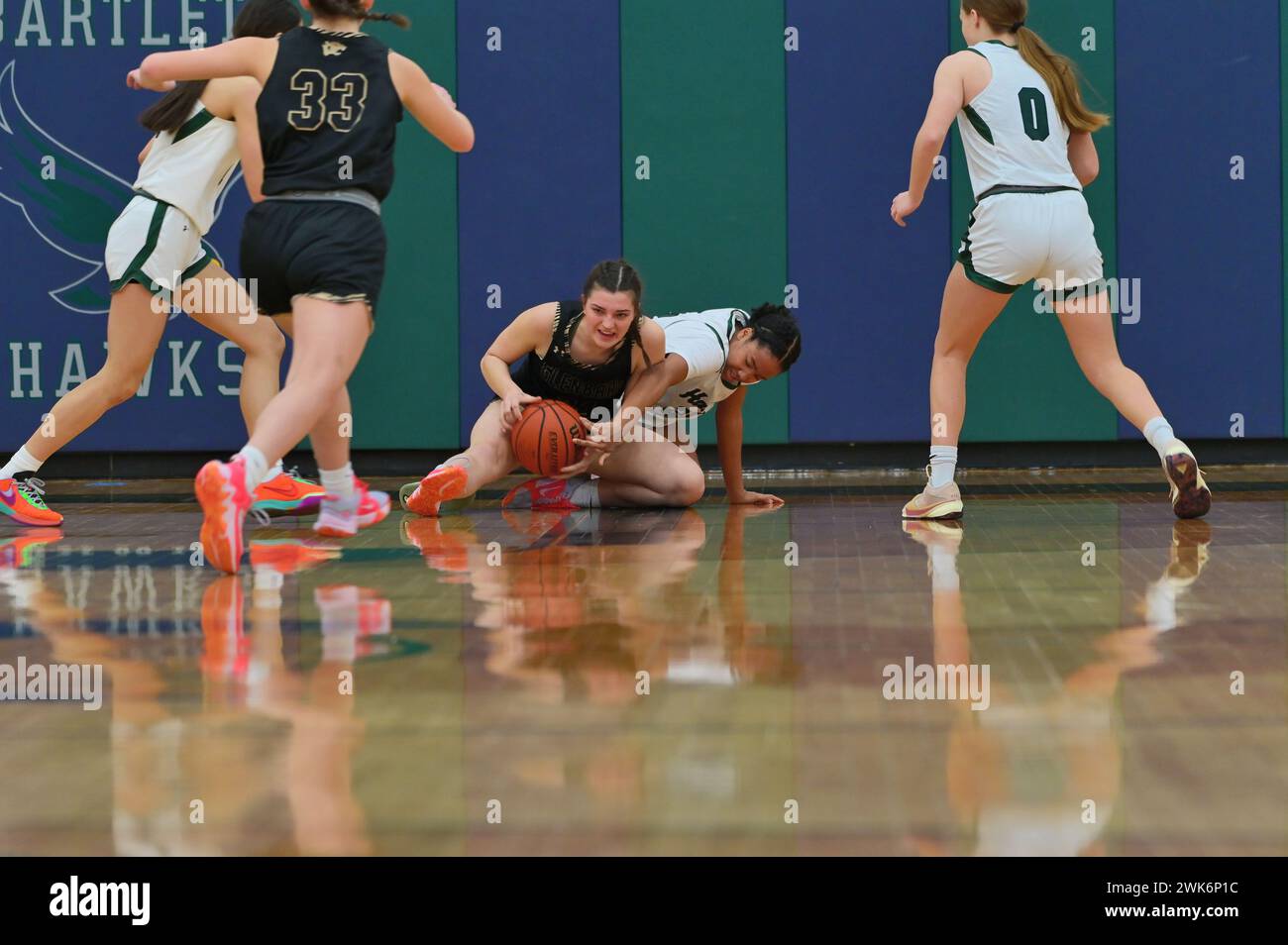 Illinois, USA Competing players battle on the floor for possession of