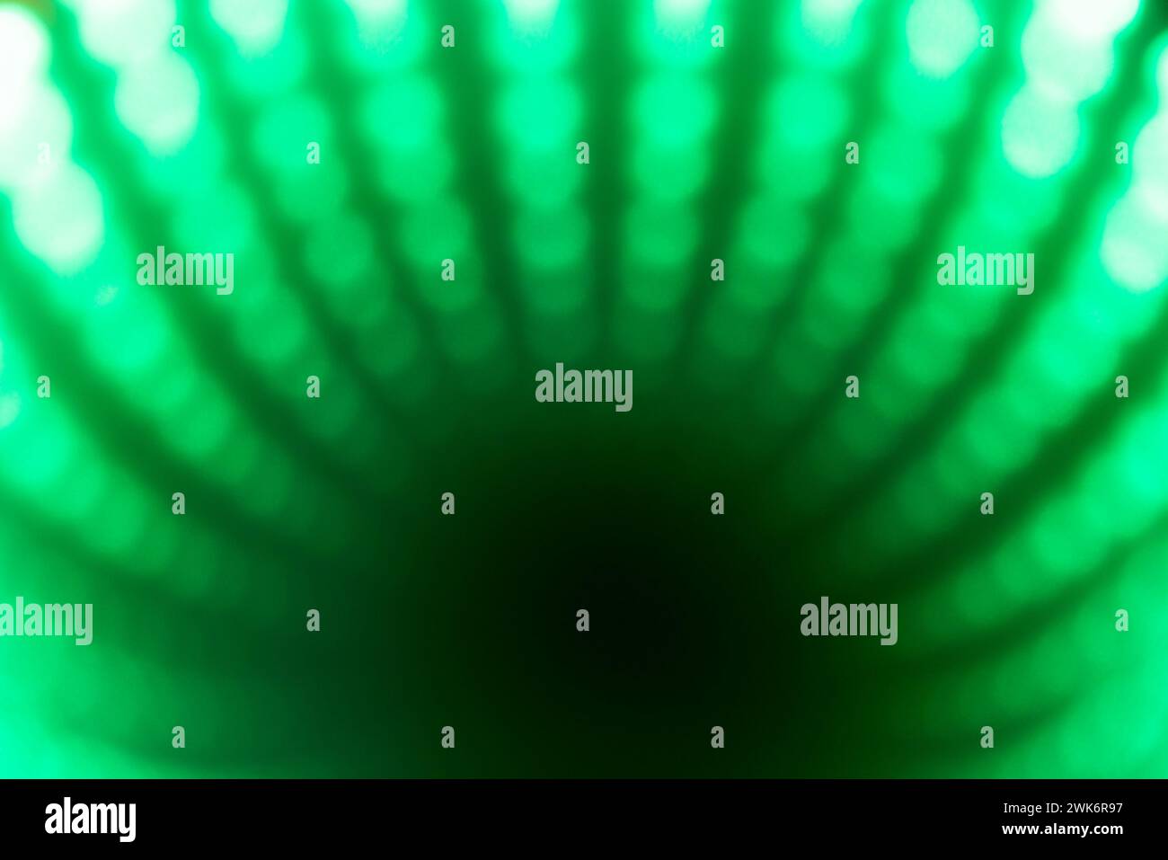 Green and black abstract dot lightburst pattern Stock Photo
