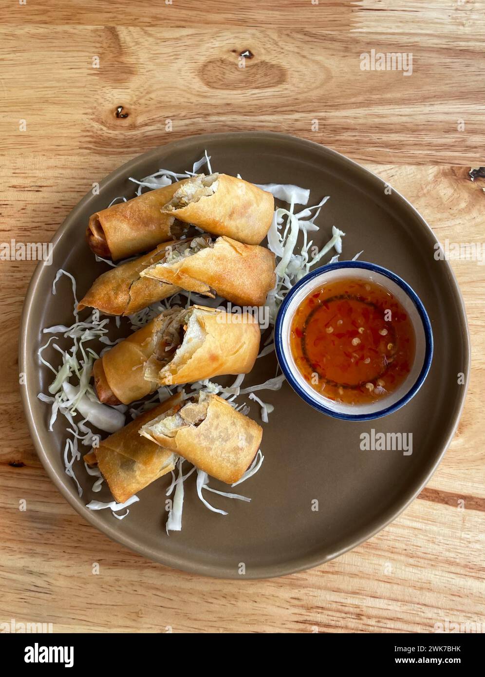 Top view famous traditional thai food spring rolls with sweet and sour
