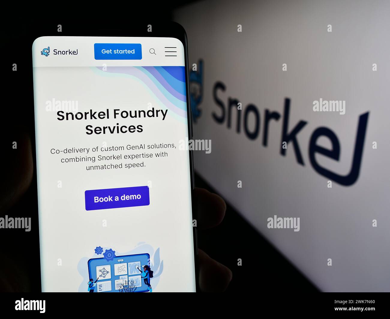 Person holding cellphone with web page of US artificial intelligence company Snorkel AI Inc. in front of logo. Focus on center of phone display. Stock Photo