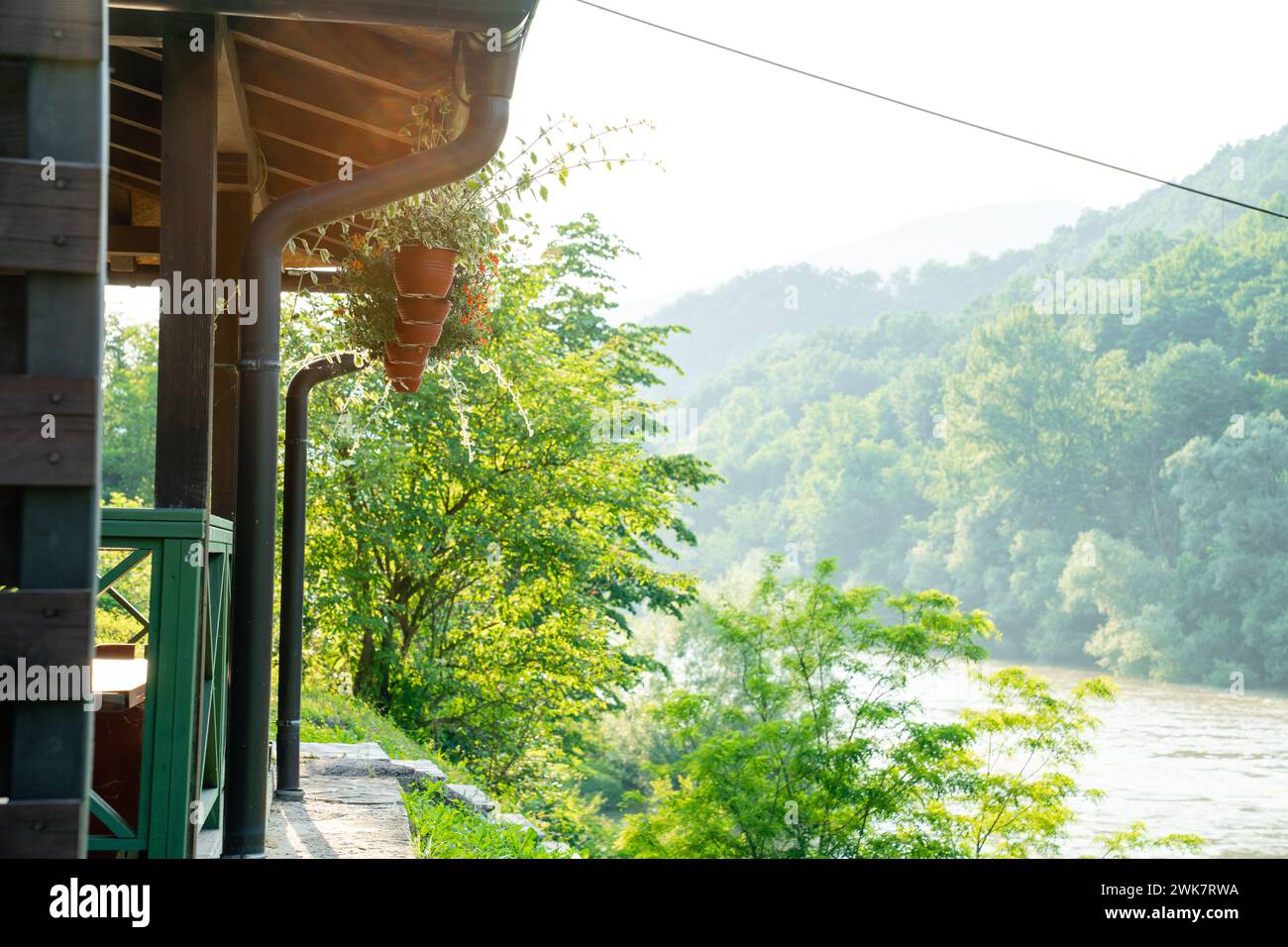 Porch of a wooden house in the forest on the river bank Stock Photo - Alamy