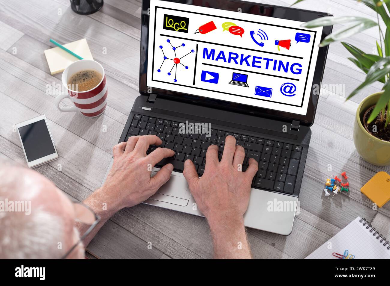 Marketing concept shown on a laptop used by a man Stock Photo - Alamy
