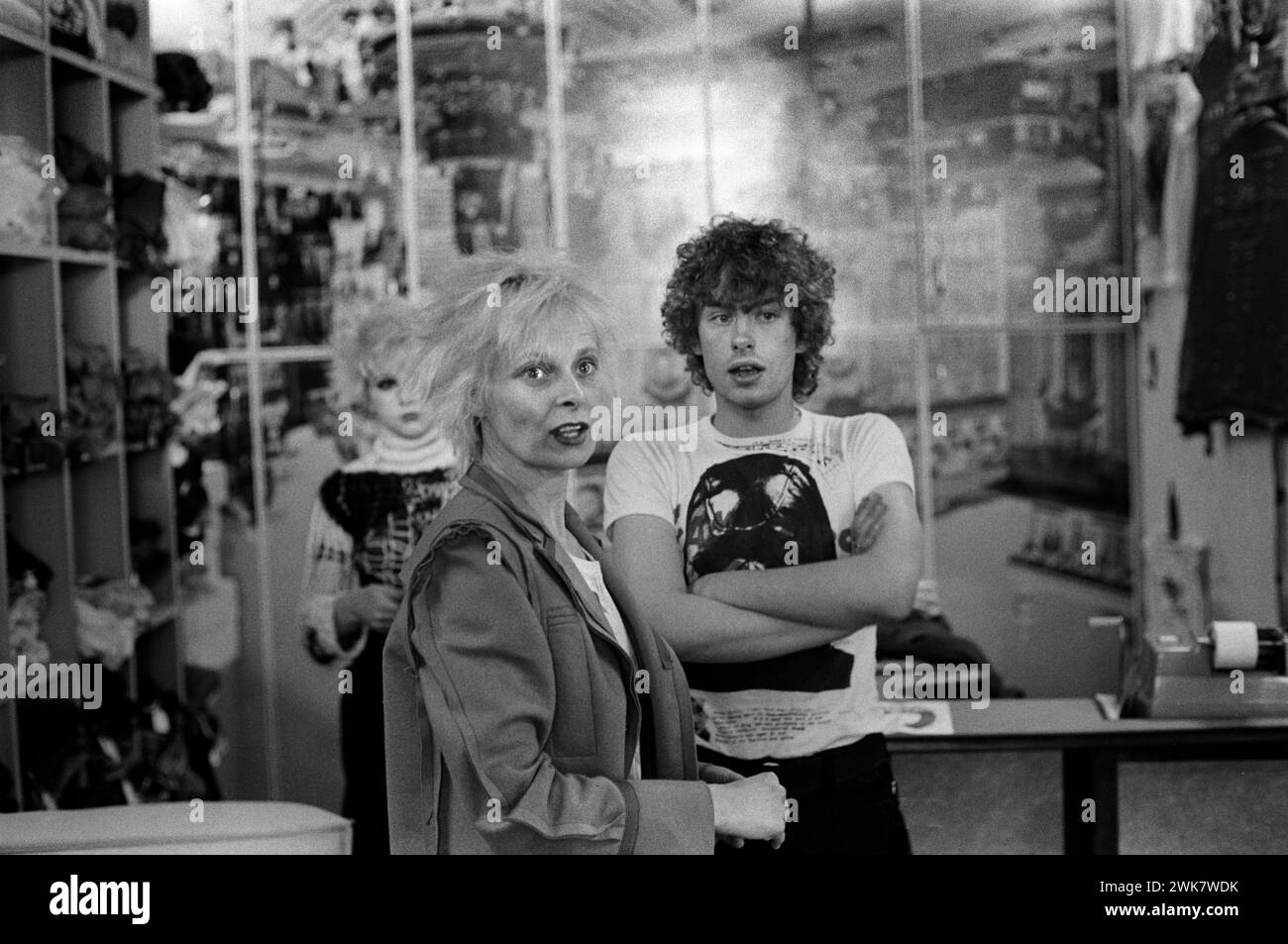 Vivienne Westwood wearing a felt Inside Out Jacket in her shop Seditionaries in the Kings Road Chelsea. Shop assistants Michael Collins who wears Cambridge Rapist design T shirt, produced by Westwood’s partner Malcolm McLaren a couple of years earlier. Chelsea, London, England 1977 1970s UK HOMER SYKES Stock Photo