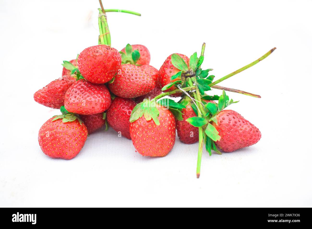 Strawberry isolated. Strawberries with leaf isolate. Whole and half of strawberry on white. Strawberries isolate. Side view strawberries set. Stock Photo