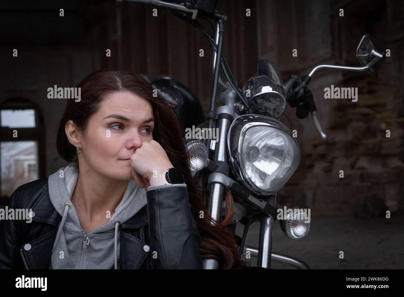 Portrait of a biker girl with a pensive look Stock Photo