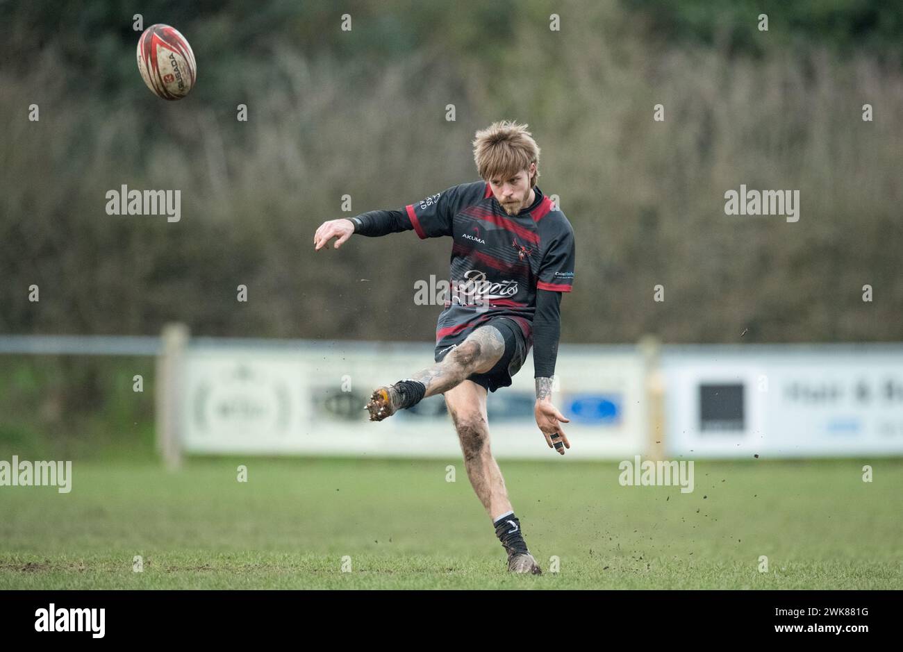 Male amateur rugby union football players playing a game of rugby and kicking the rugby ball for extra 2 points. Stock Photo