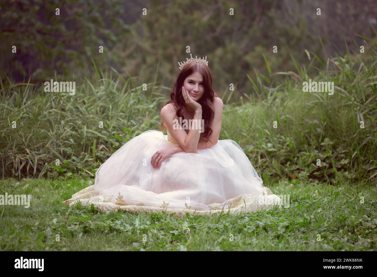 Smiling Woman in White Gown in Field Stock Photo