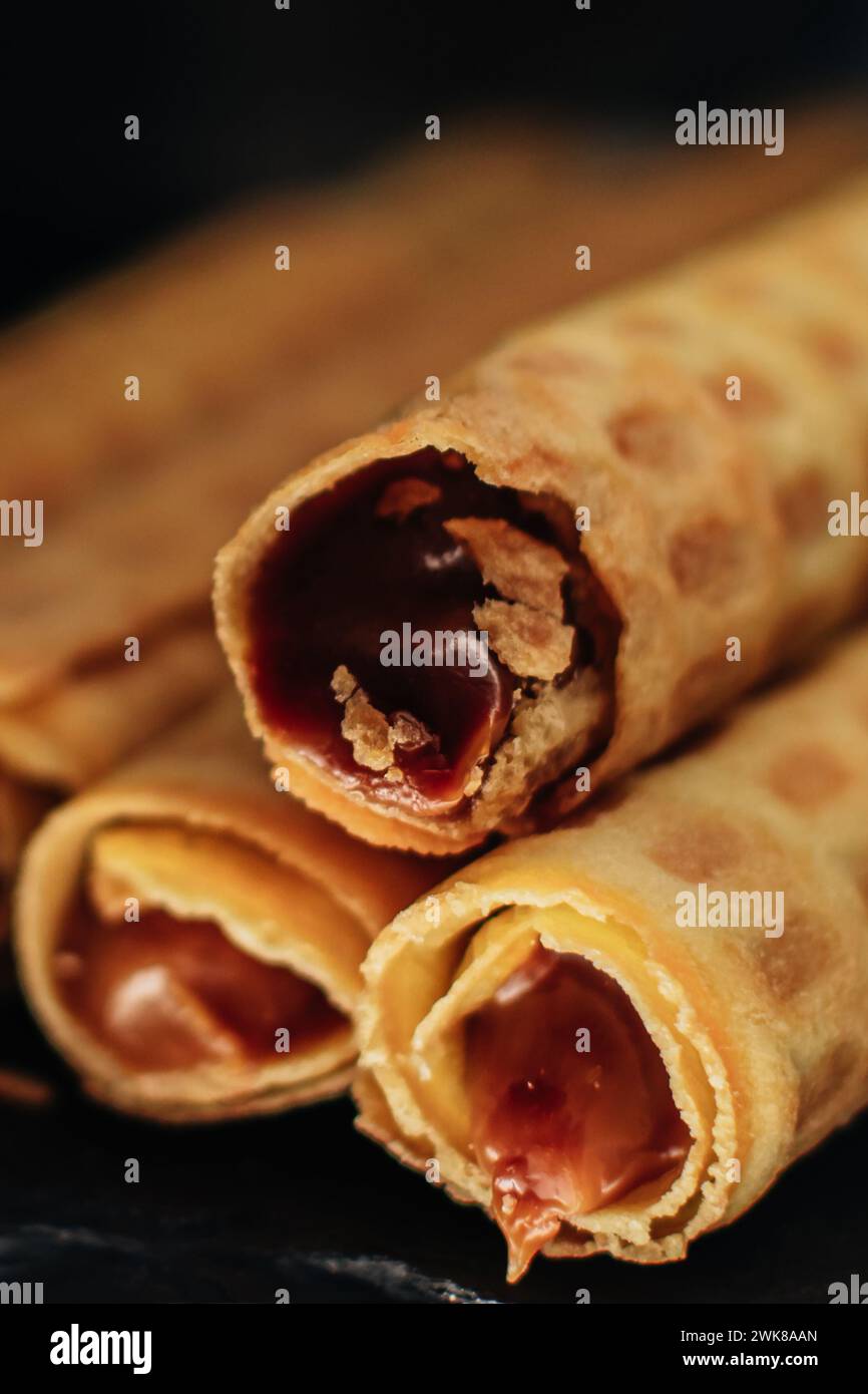 Sweet wafer rolls with chocolate condensed milk Stock Photo Alamy