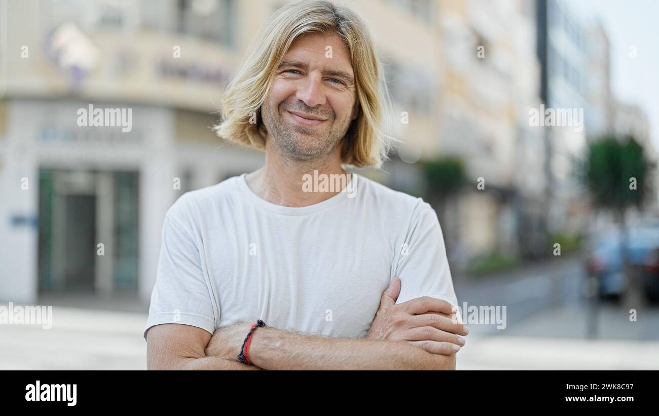Blond man long hair stands hi-res stock photography and images - Alamy