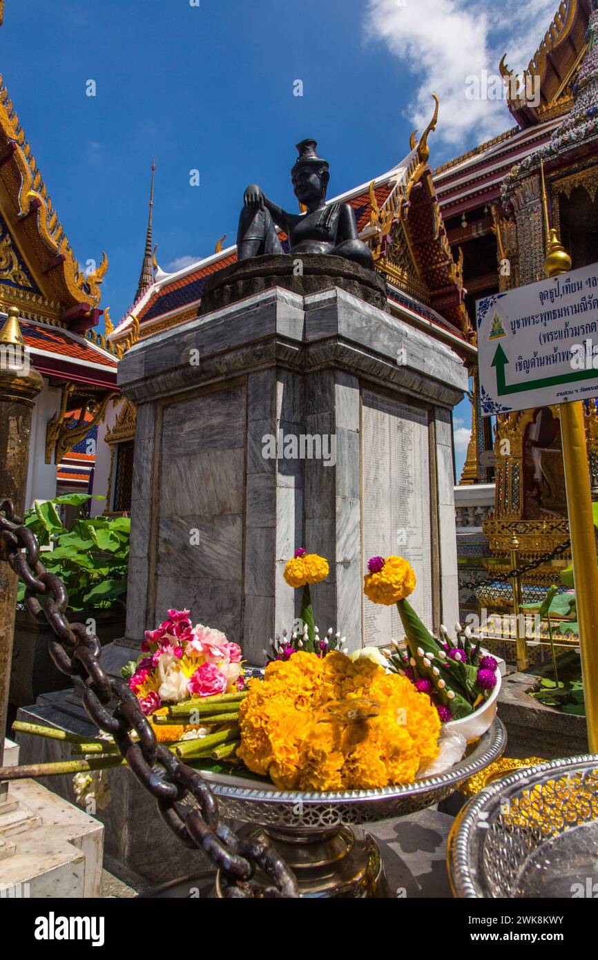 A votive offering at the base of the statue of the Hermit Doctor