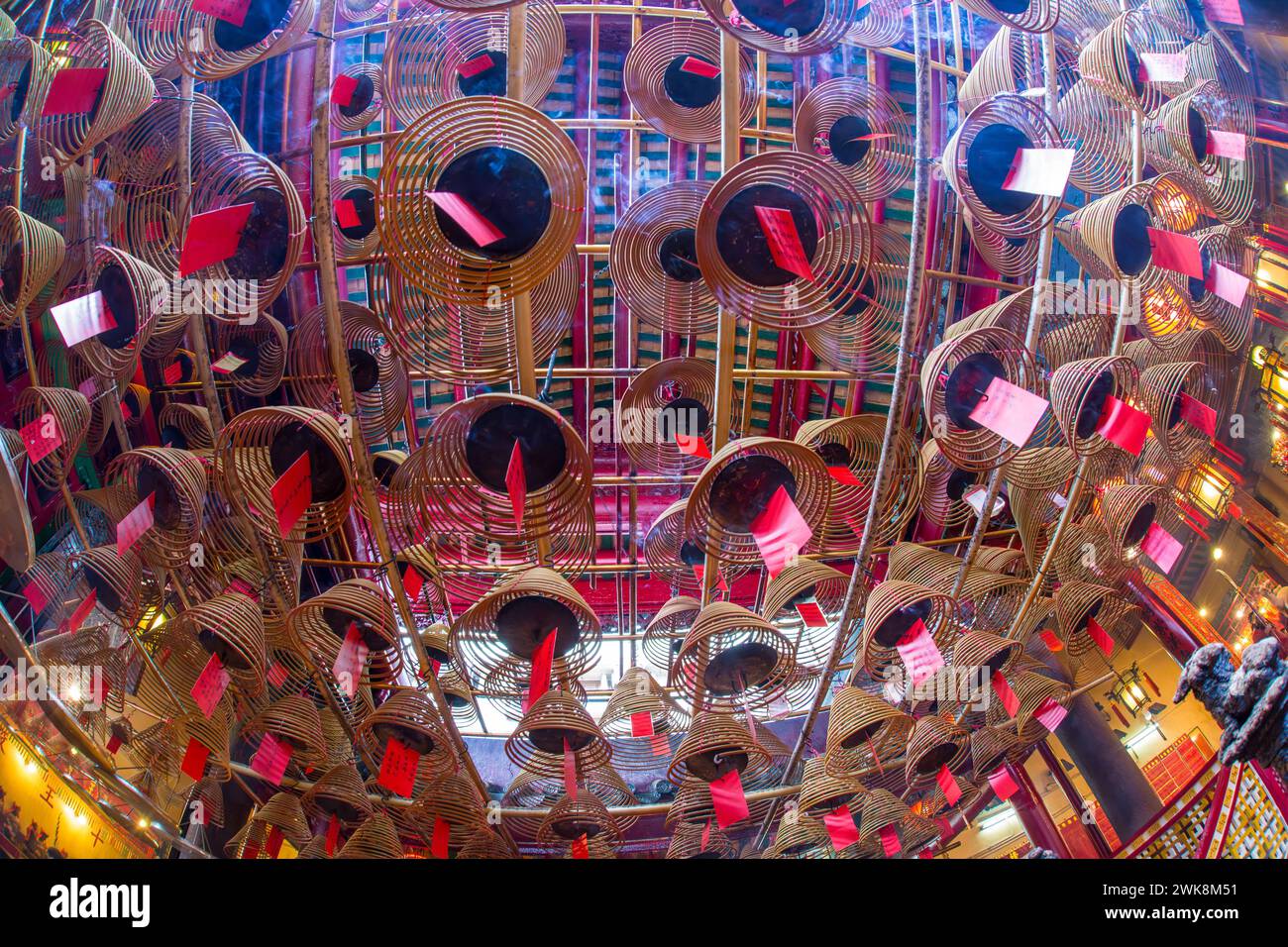 Burning incense coils send prayers to heaven in the Man Mo Temple, a ...