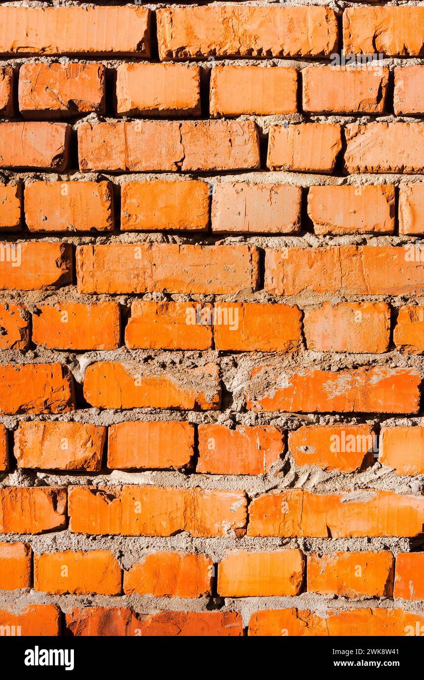 texture of a wall of red brick. dirty masonry pattern. reconstruction process Stock Photo