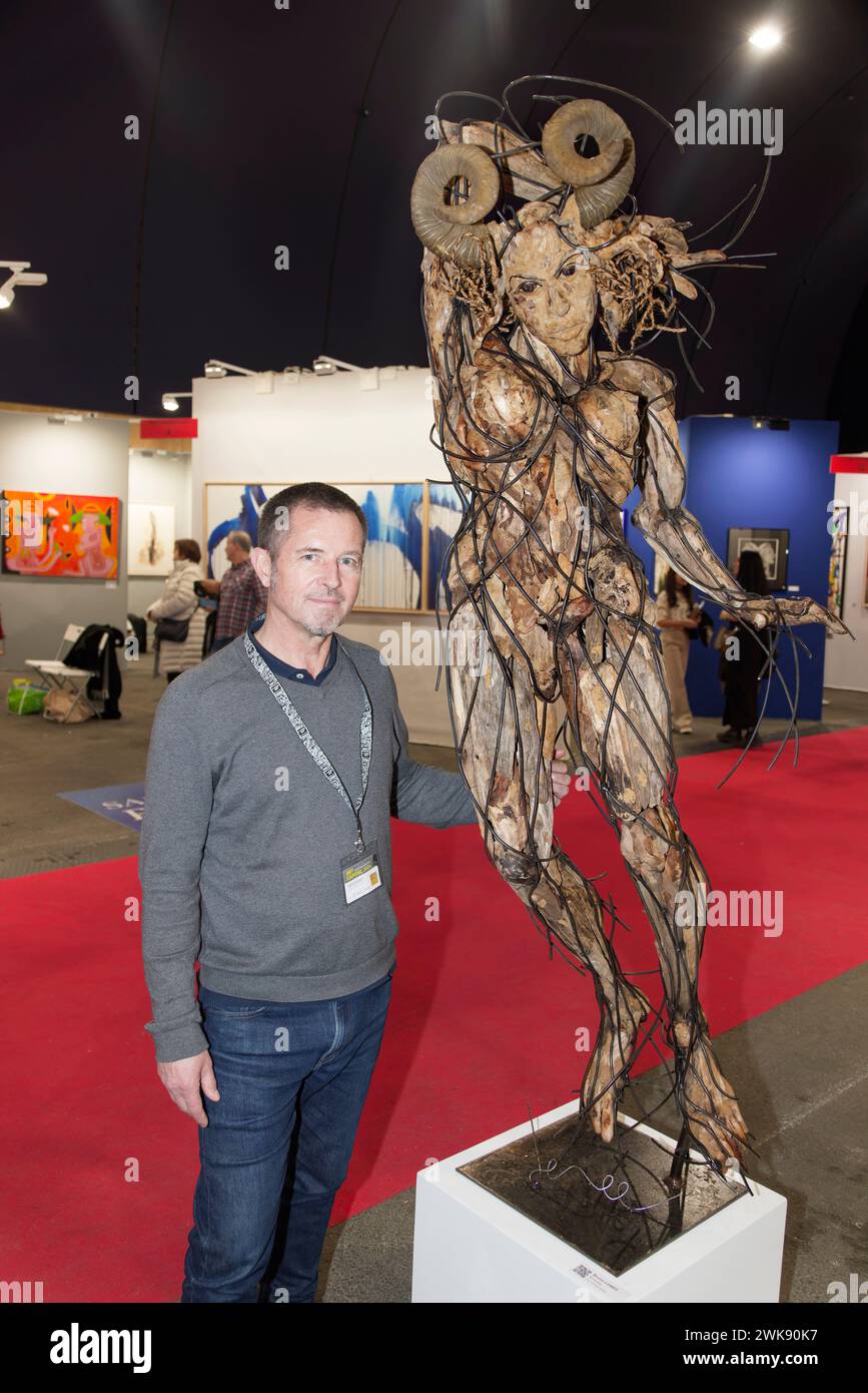 Paris, France. 17th Feb, 2024. Artist Bruno Lemée poses next to his ...