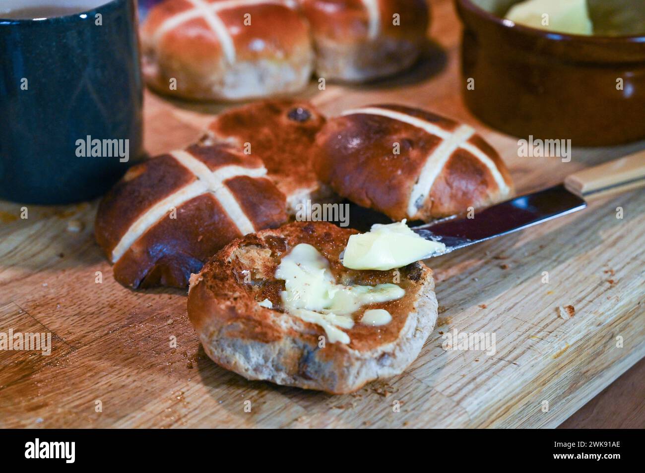 Toasted Hot Cross Buns with butter a traditional breakfast food eaten