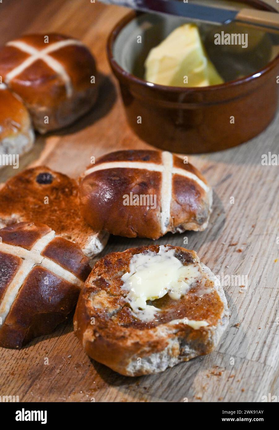 Toasted Hot Cross Buns with butter a traditional breakfast food eaten