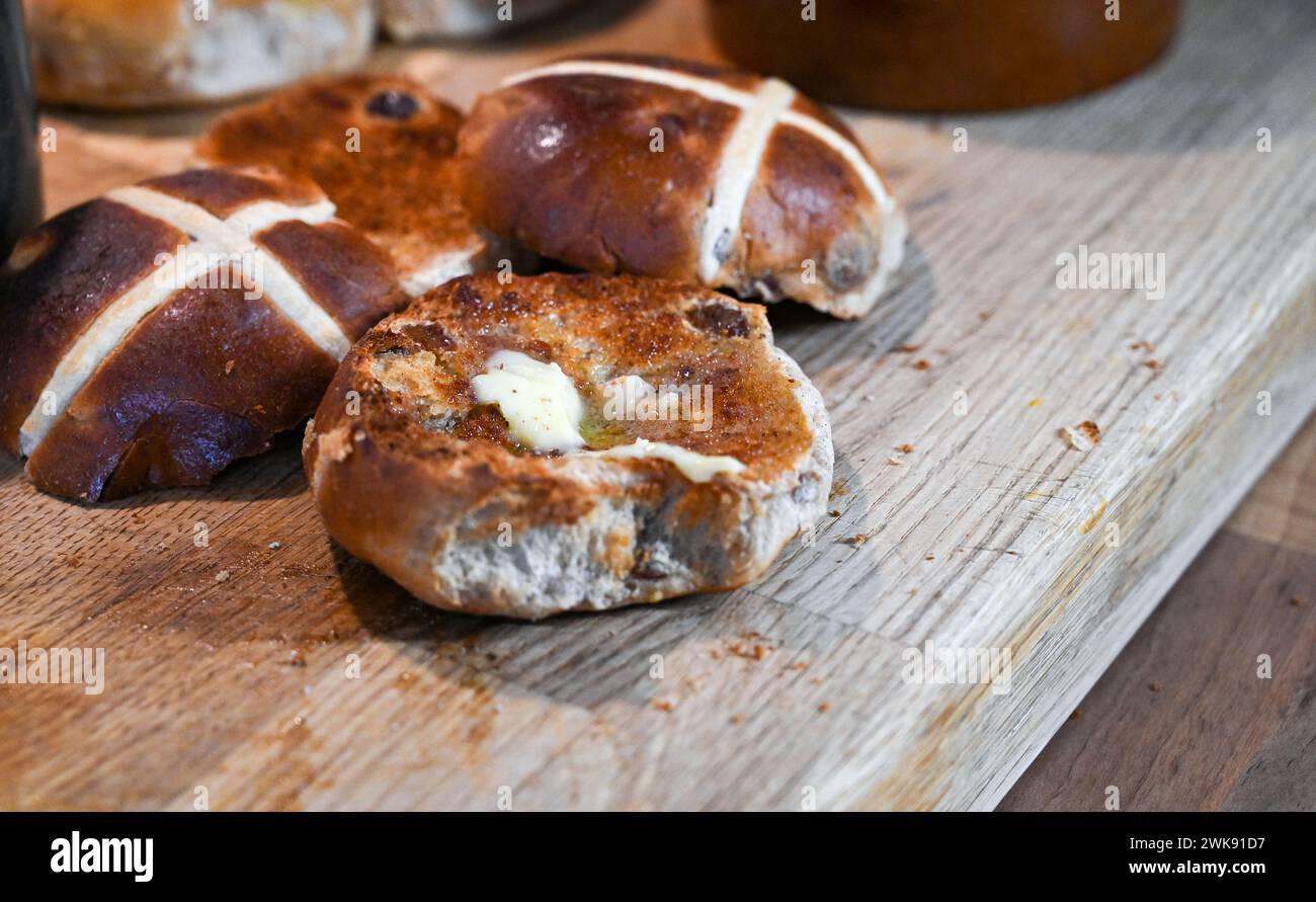 Toasted Hot Cross Buns with butter a traditional breakfast food eaten