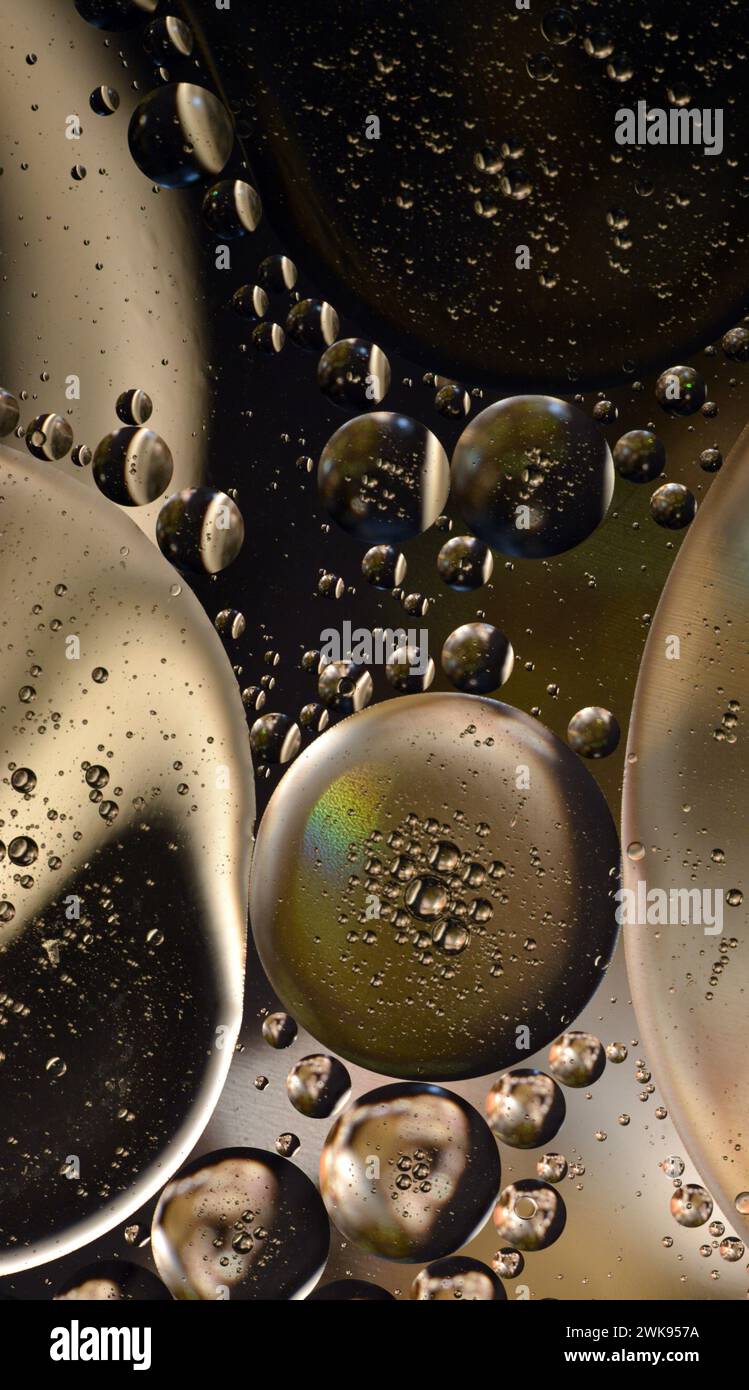 Abstract oil bubbles on water with reflections of colors and patterns. Abstract background. Abstract screensaver. Abstract artwork. Stock Photo