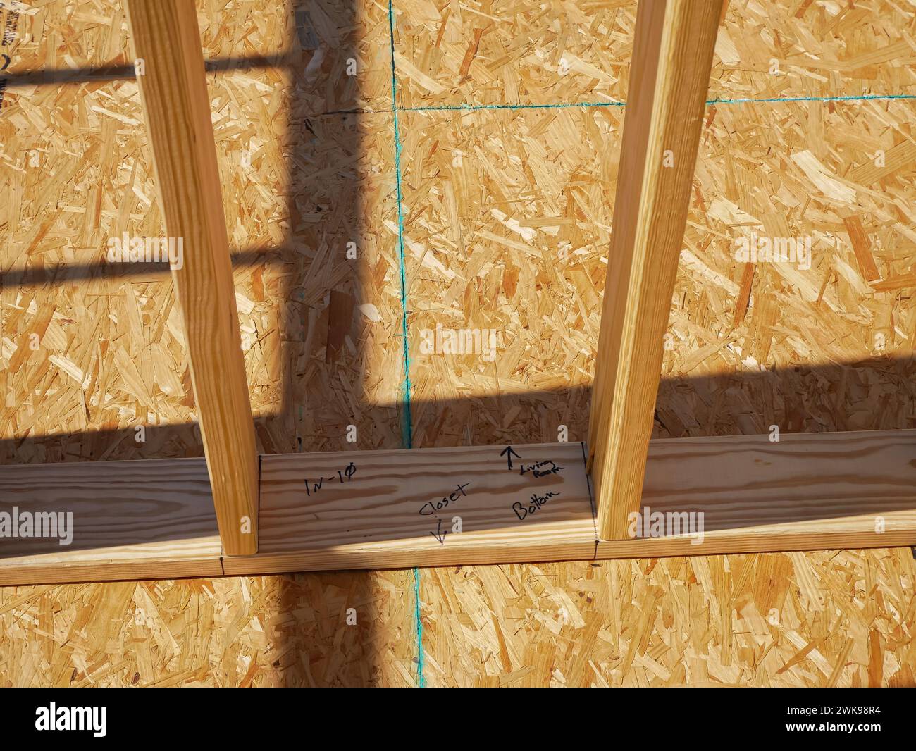 Post beam stud timber framing with marker on OSB sub flooring sheets