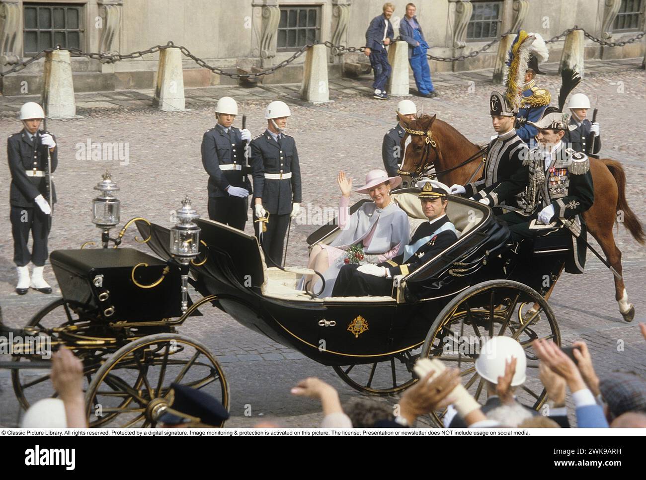 Carl XVI Gustaf, King of Sweden. Born 30 april 1946.  Pictured with Queen Margrethe of Denmark 1985 in an open horsedrawn carriage outside the royal castle in Stockholm Sweden. The two royals are cousins. *** Local Caption *** © Classic Picture Library. All rights reserved. Protected by a digital signature. Image monitoring & protection is activated on this picture. The license; Presentation or newsletter does NOT include usage on social media. Stock Photo