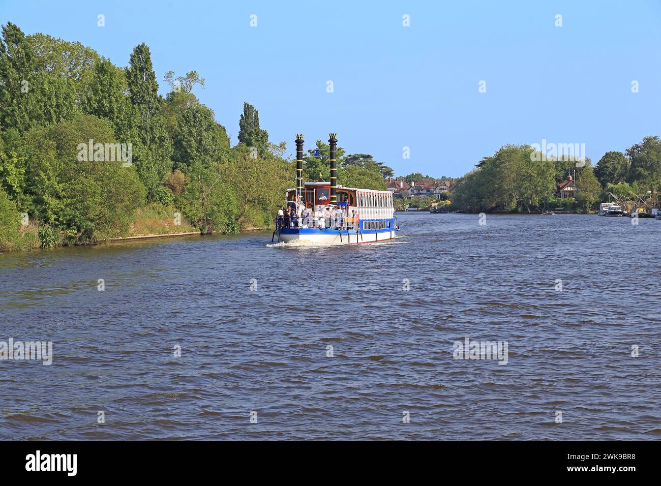 HAMPTON, GREAT BRITAIN - MAY 18, 2014: It is a retro steamer with people on a river walk along the Thames. Stock Photo