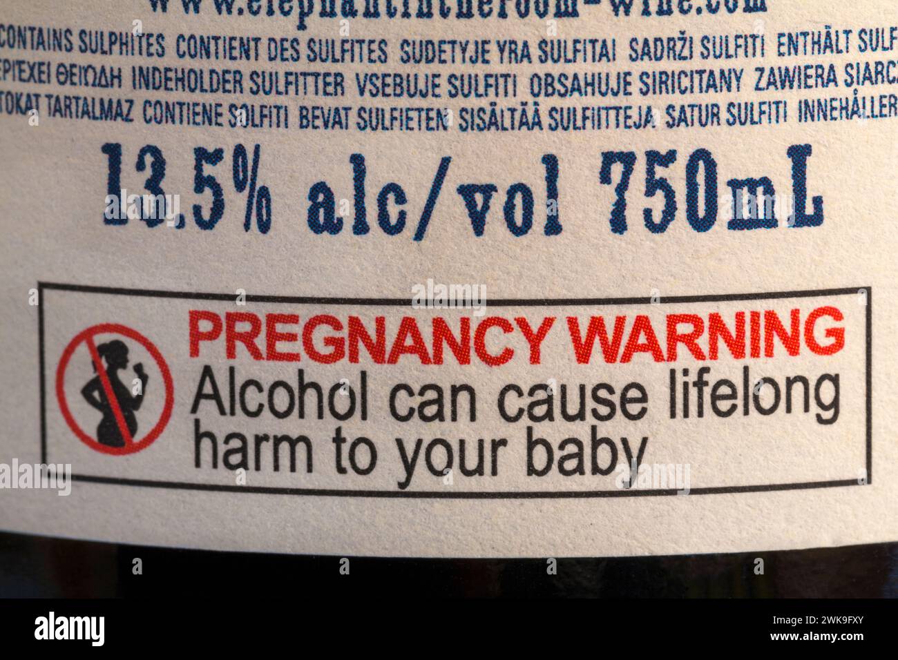 Pregnancy warning alcohol can cause lifelong harm to your baby on back of Elephant in the Room palatial Pinot Noir 2022 bottle of red wine Stock Photo