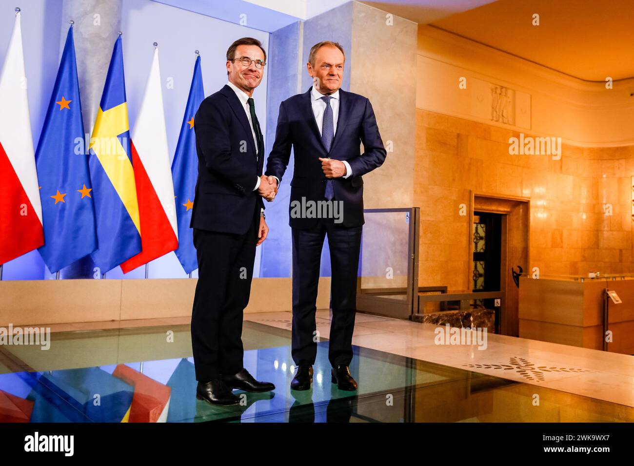 Warsaw, Poland. 19th Feb, 2024. Polish Prime Minister, Donald Tusk greets the Prime Minister of Sweden, Ulf Kristensson for a bilateral meeting in the PM's Chancellery on Ujazdowska Street in Warsaw, the capital of Poland. The NATO membership of Sweden and regional security issues after the Russian war on Ukraine are on the agenda. Credit: SOPA Images Limited/Alamy Live News Stock Photo