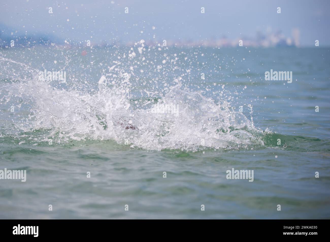 Sea wave splash with white foam Stock Photo - Alamy
