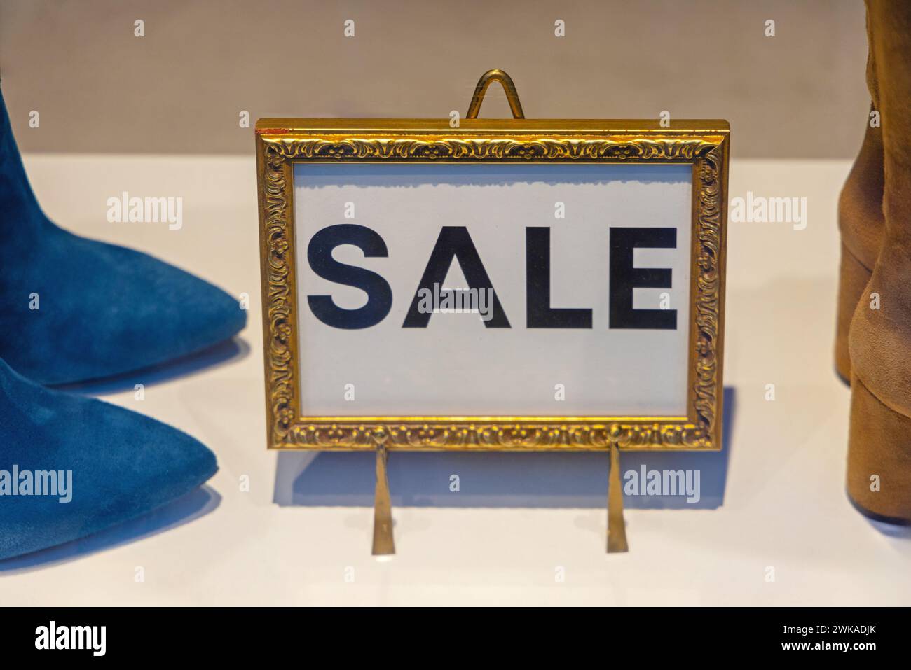 Sign Sale Golden Frame Easel at Retail Shop Window Stock Photo