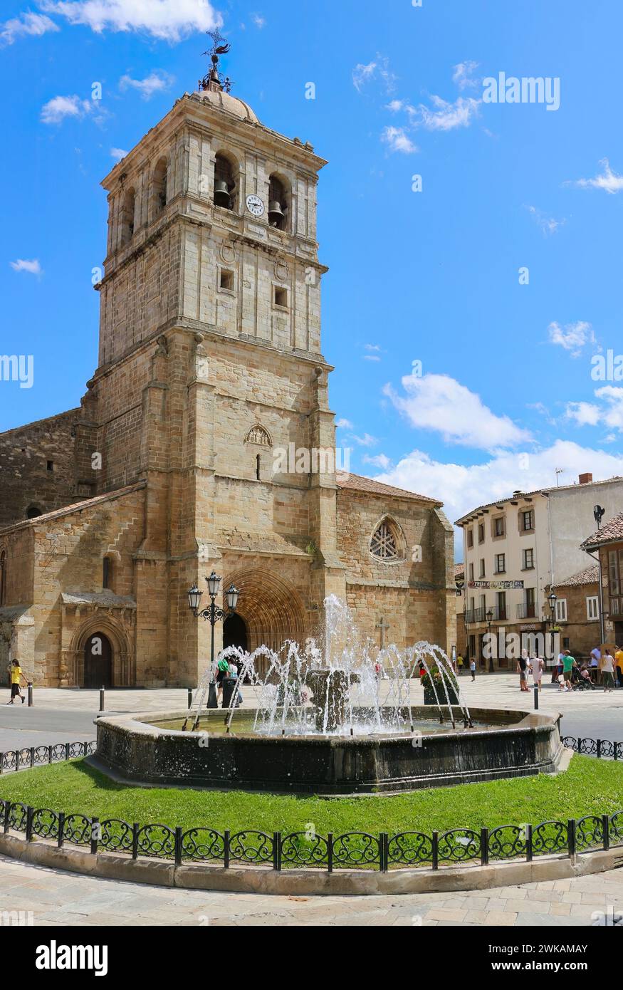 Roman Catholic church Colegiate of San Miguel entrance and fountains Plaza de Espana Aguilar de Campoo Palencia Castile and Leon Spain Stock Photo