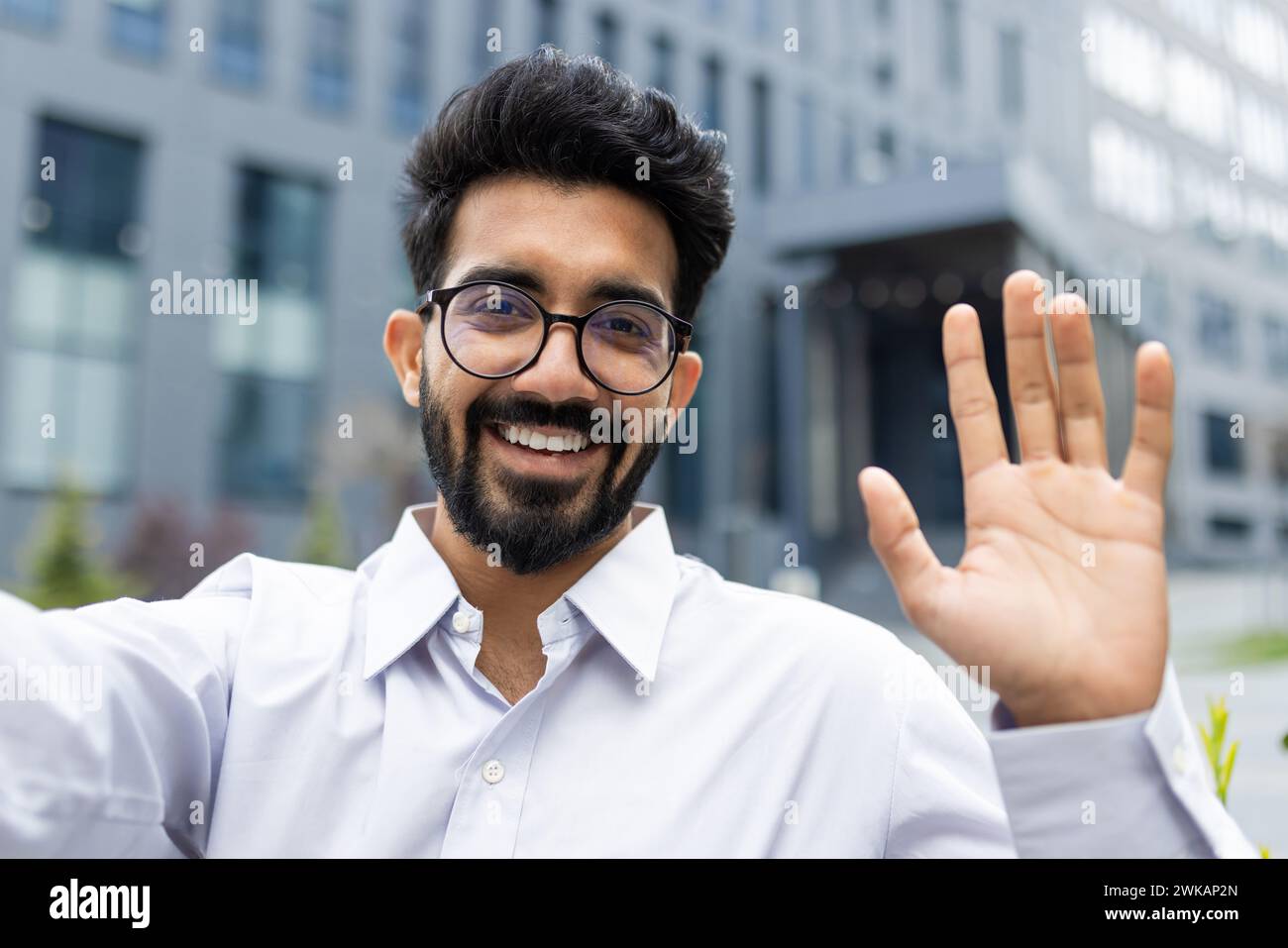 Young successful businessman outside office building walking in daytime ...