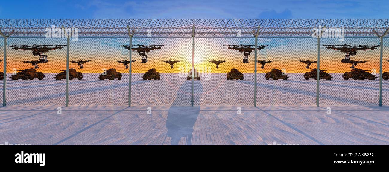 Twilight Guard: Drones and Armored Vehicles Behind Security Fencing Stock Photo