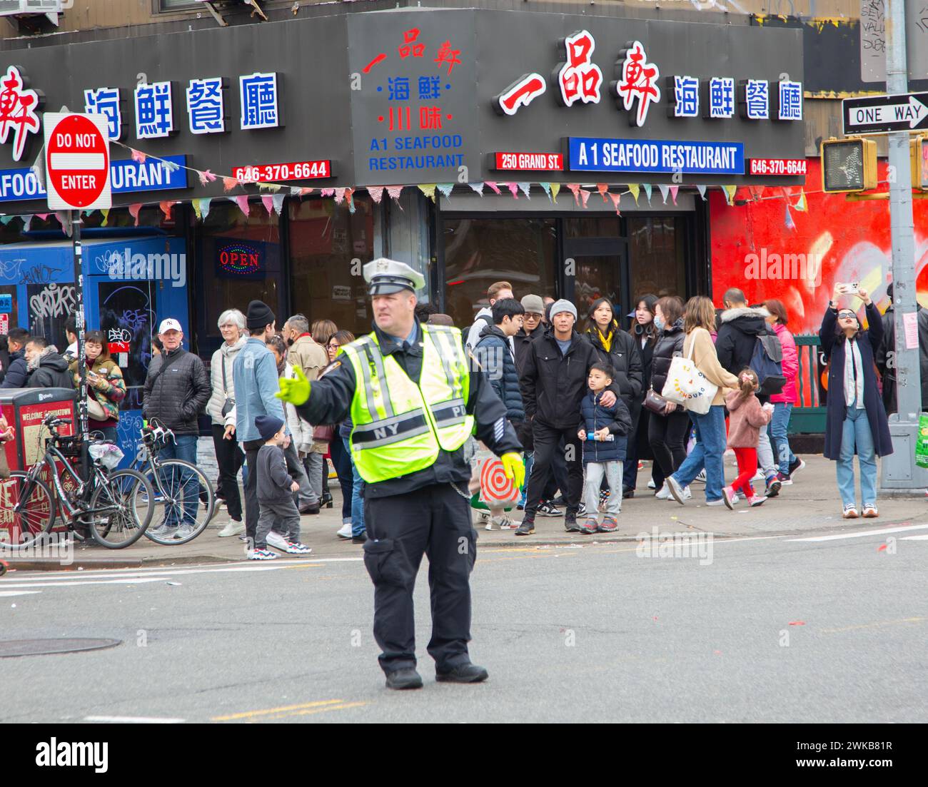 NYPD Traffic Cop directing traffic in Chinatown during Chinese New Year in Manhattan, New York City. Stock Photo