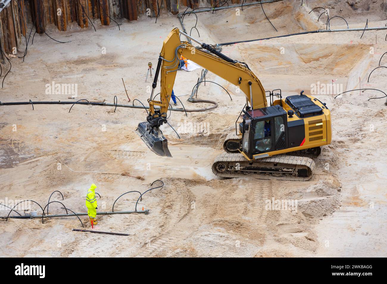 Shovel excavator preparing the excavation pit with drainage Stock Photo
