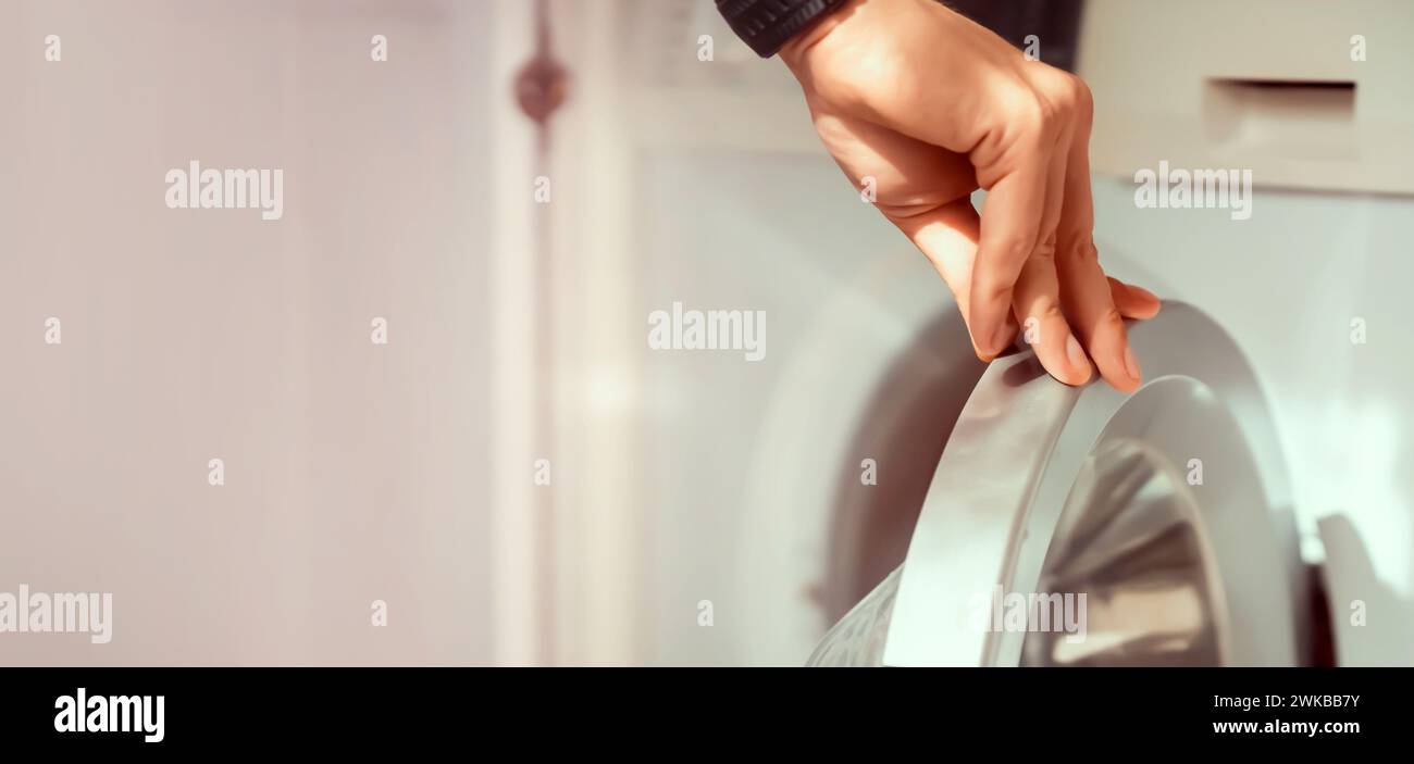 Man using washing machine hi-res stock photography and images - Alamy