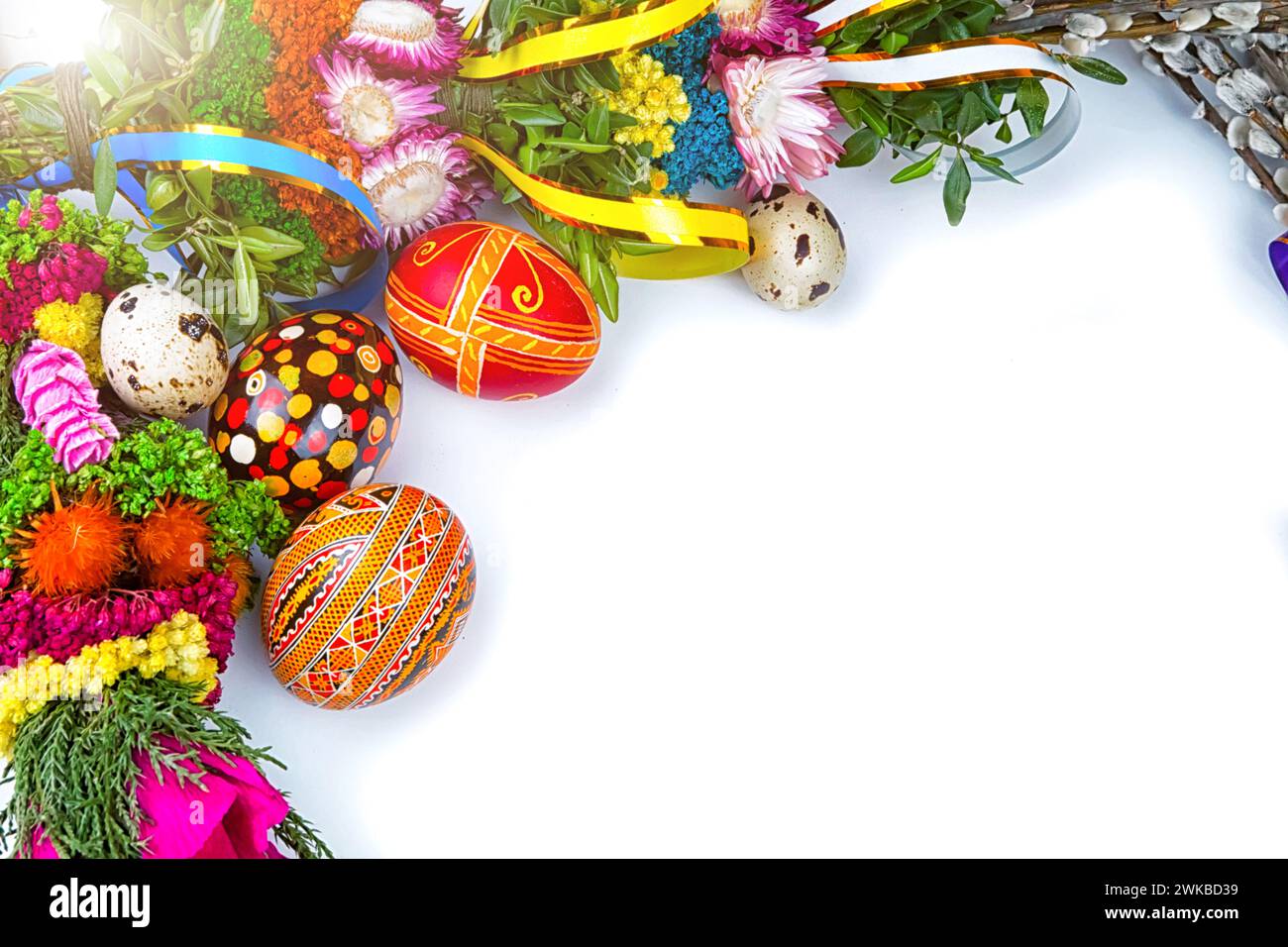 Easter eggs and willow branches on a white background Stock Photo - Alamy