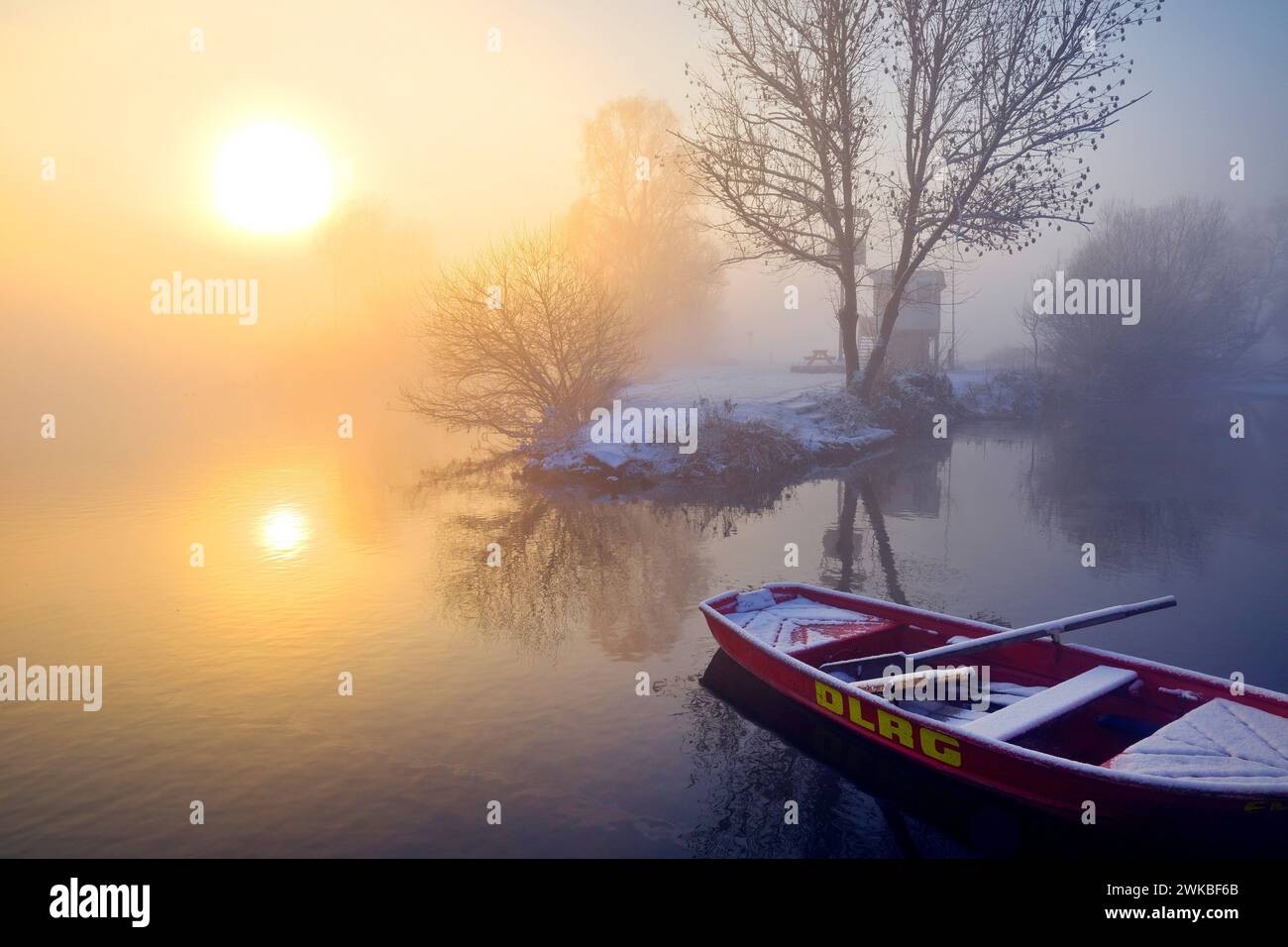 Ruhr in winter with rowing boat of DLRG in the early morning fog, Germany, North Rhine-Westphalia, Ruhr Area, Witten Stock Photo