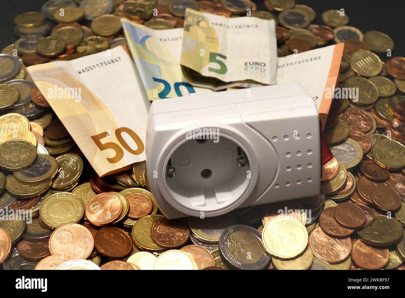 plug adapter and money, symbolic image of electricity costs Stock Photo