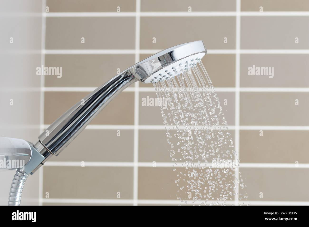 Close to the water shower head that is closed Stock Photo