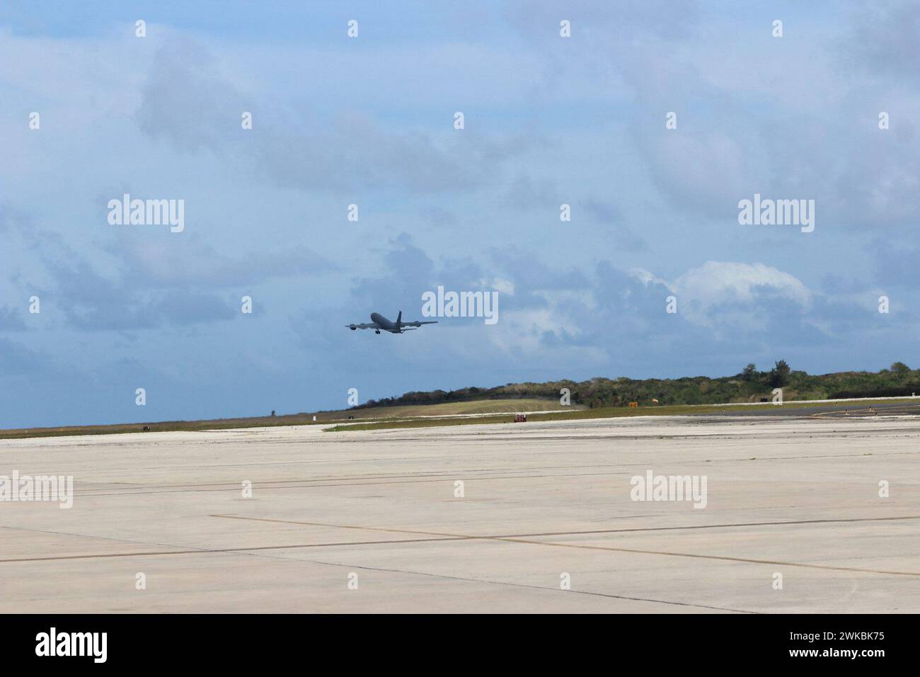 During Cope North 24, a 909th Air Refueling Squadron KC-135 Stratotanker assigned to Kadena Air Base, Japan, takes off from Saipan Feb. 12, 2024. Cope North participants are launching aircraft out of six  locations, demonstrating the agile, large-force employment capabilities of partnering nations. (U.S. Air Force photo by Tech. Sgt. Daniel Holliday) Stock Photo