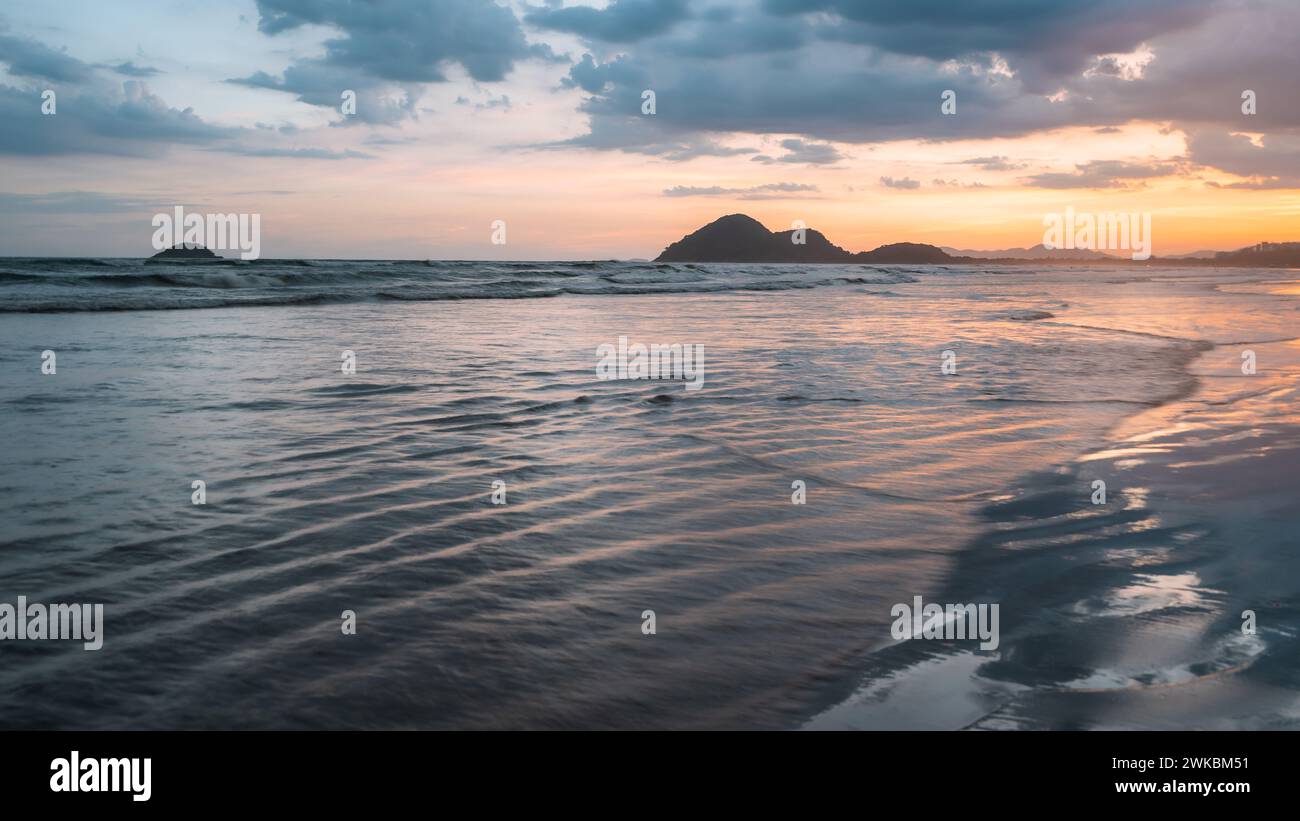 Beautiful sunset at the beach of Bertioga, São Paulo, Brazil. Stock Photo