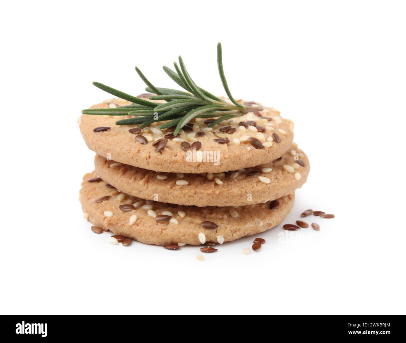 Stack of round cereal crackers with flax, sunflower, sesame seeds and ...