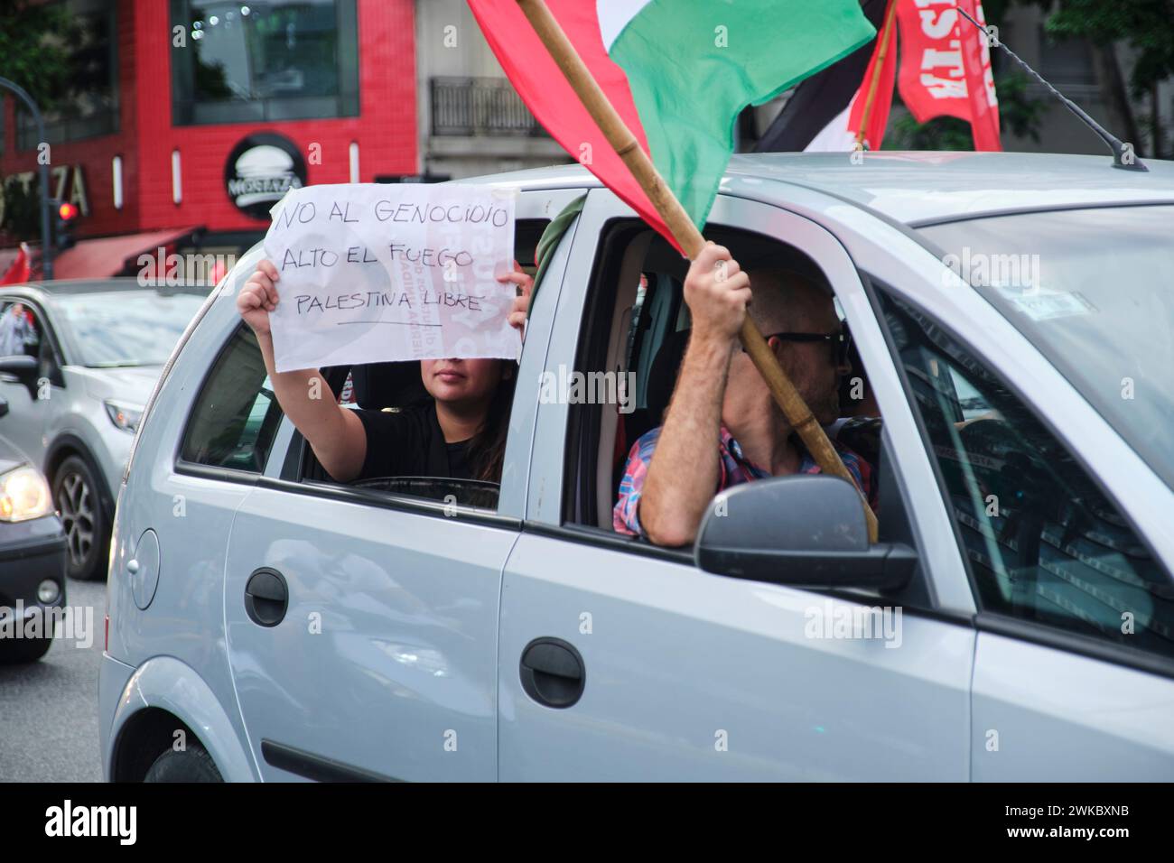 Buenos Aires, Argentina, Feb 16, 2024: Protest in solidarity with Palestine against Israel attack. Unrecognizable woman holding a poster: No to genoci Stock Photo