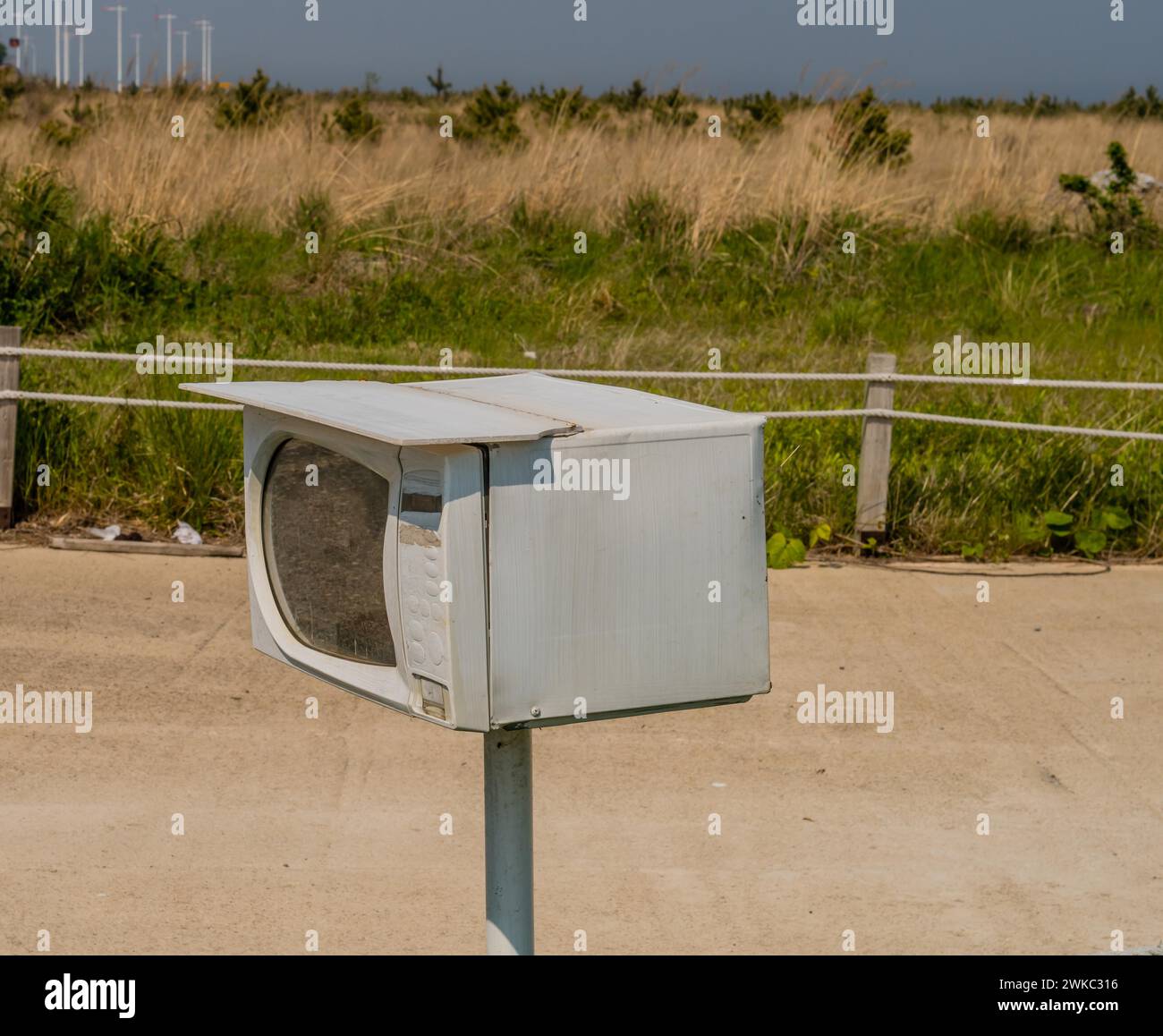 Small microwave oven on metal pole used as mailbox in South Korea Stock Photo