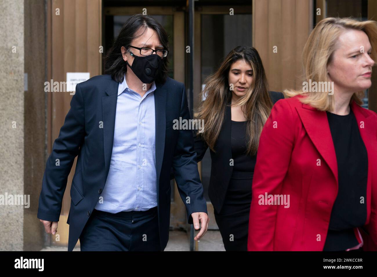 FILE Edward Kosinski, left, departs criminal court after being