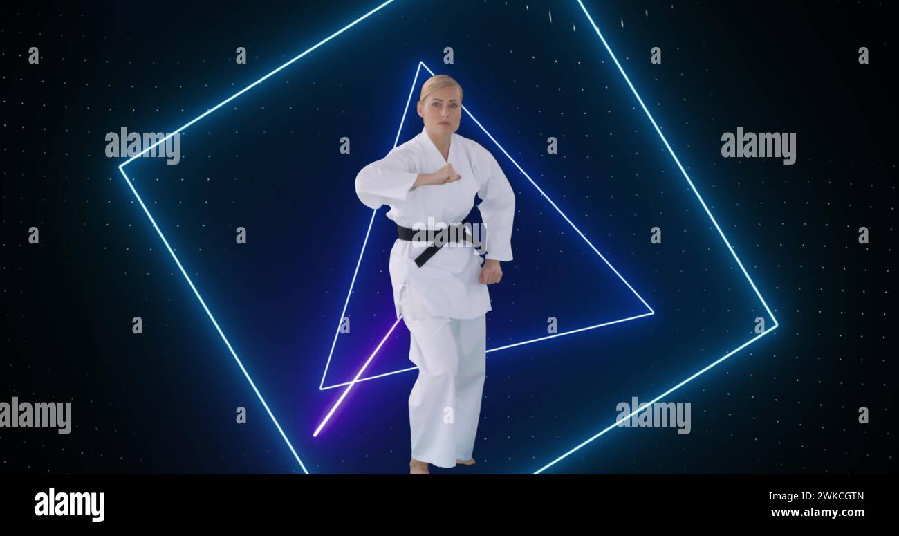 Image of purple neon scanner processing data over female martial artist Stock Photo