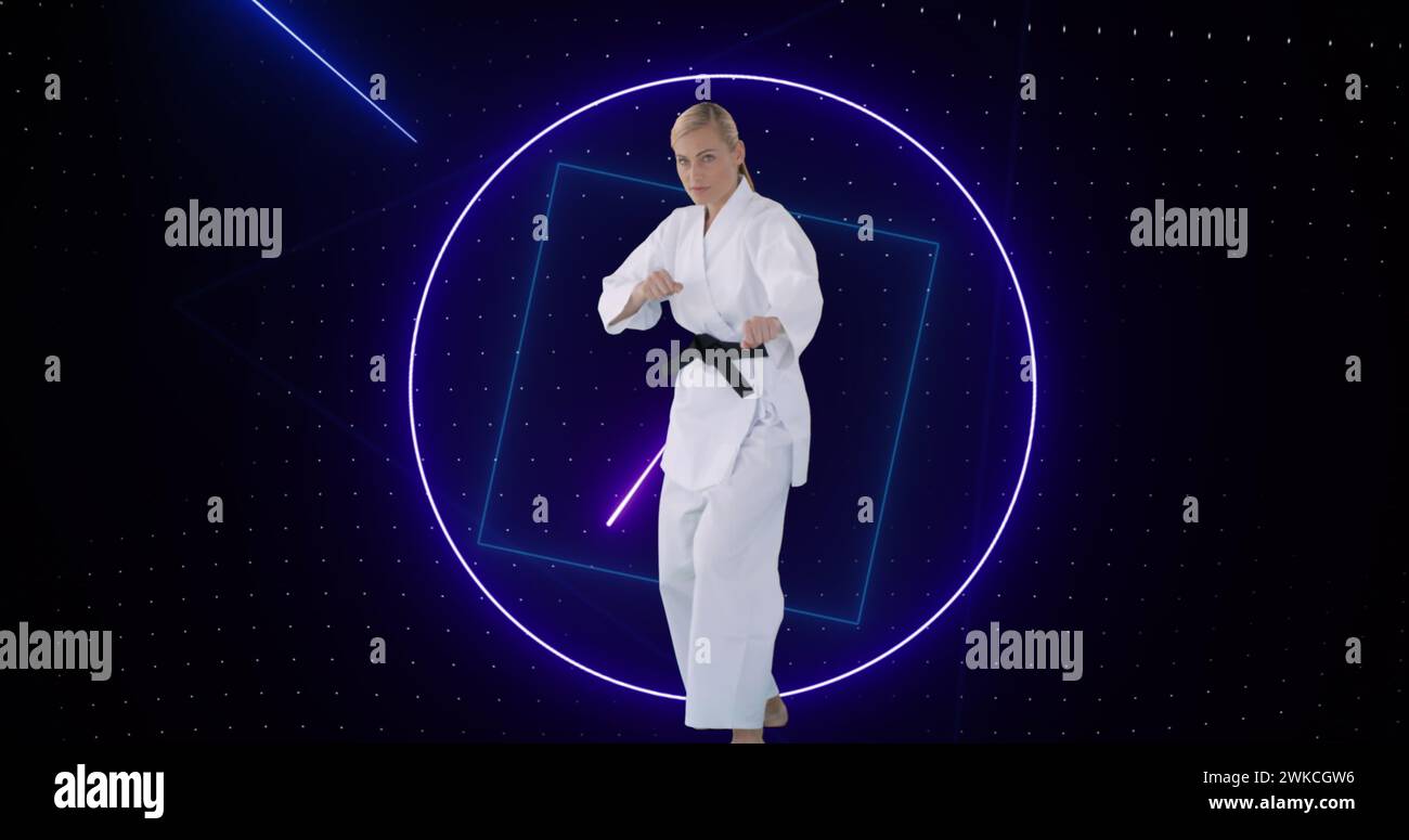 Image of purple neon scanner processing data over female martial artist Stock Photo