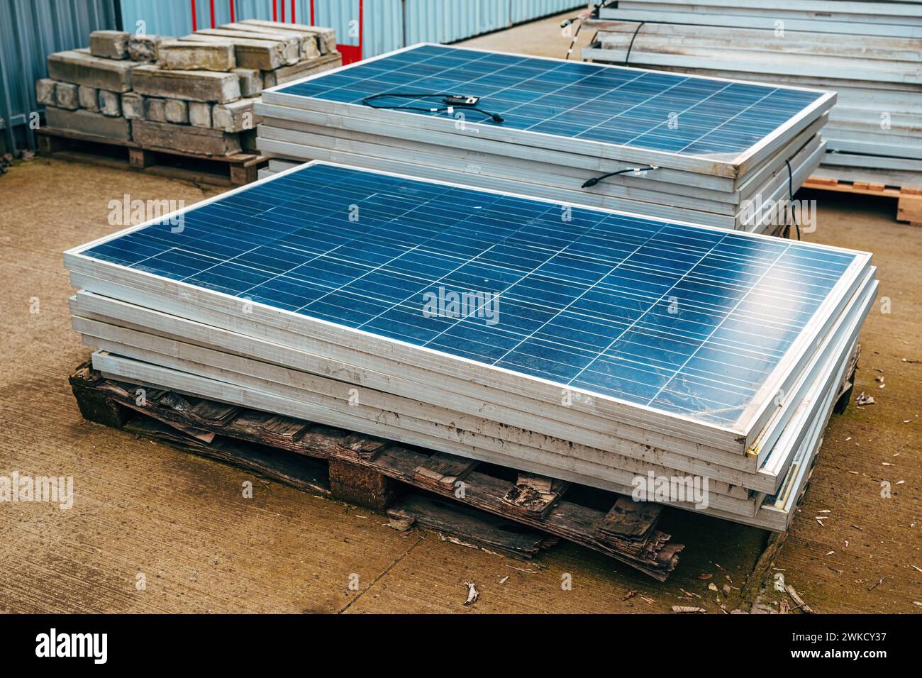 Old obsolete solar panels in factory yard, selective focus Stock Photo